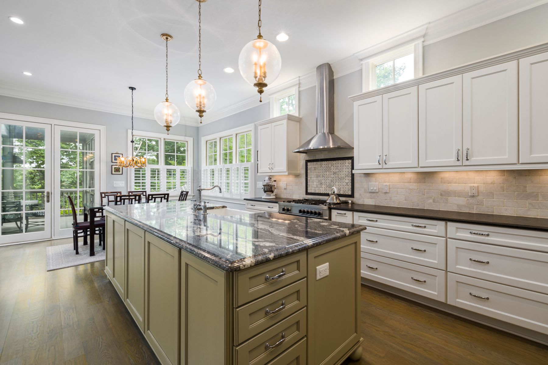 Bright kitchen with white Shaker-style cabinets and a large island