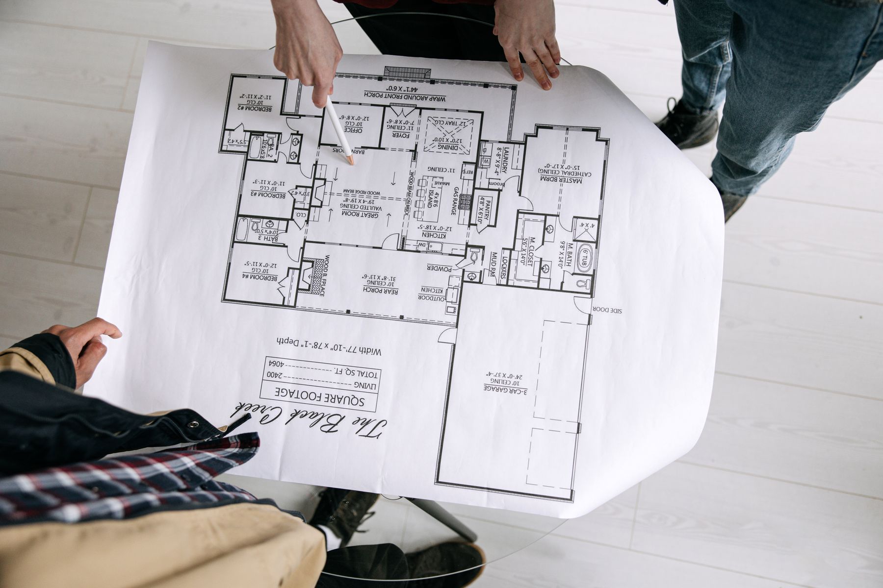 Two people reviewing a floor plan together