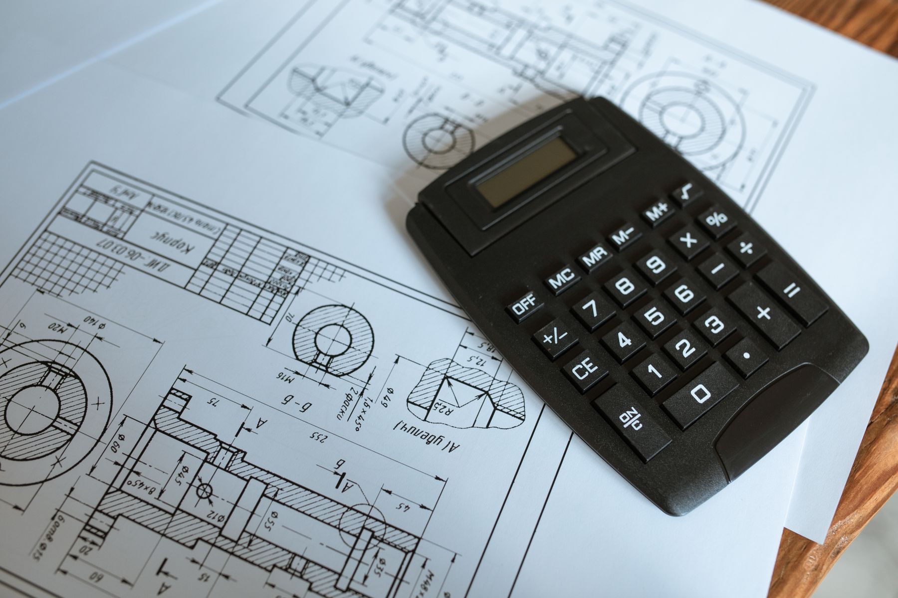 Calculator resting on technical drawings